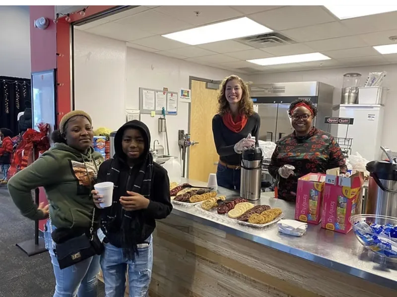 Community gathering during Open Streets West Broadway 2025